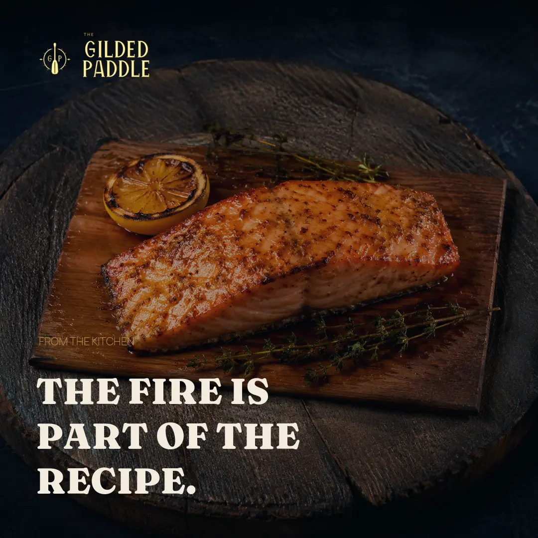 Social post: a fillet finishing over open flame on a board.